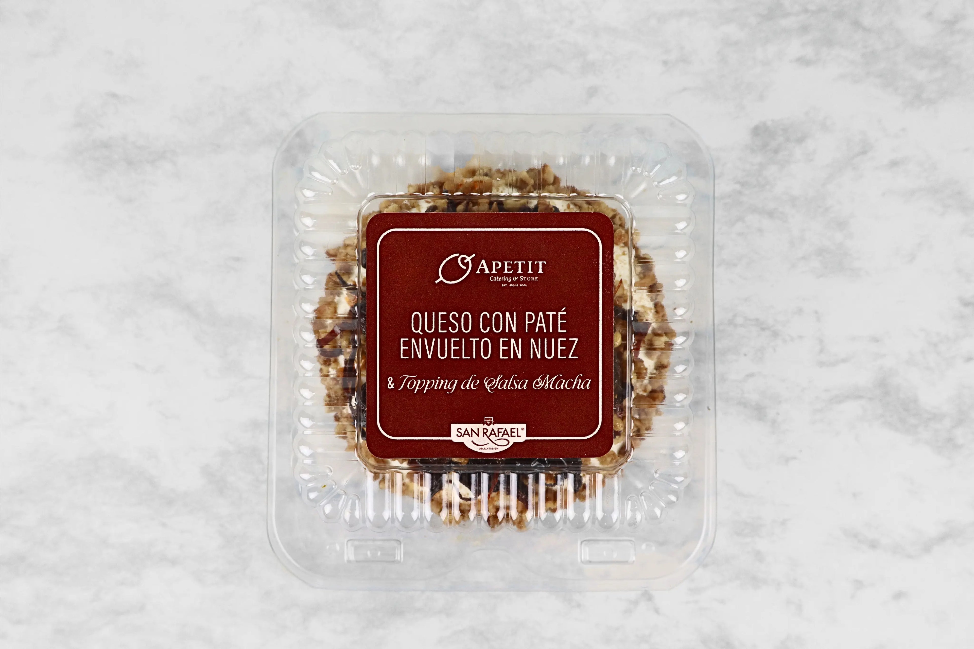 Queso con Paté Envueto en Nuez y Topping de Salsa Macha